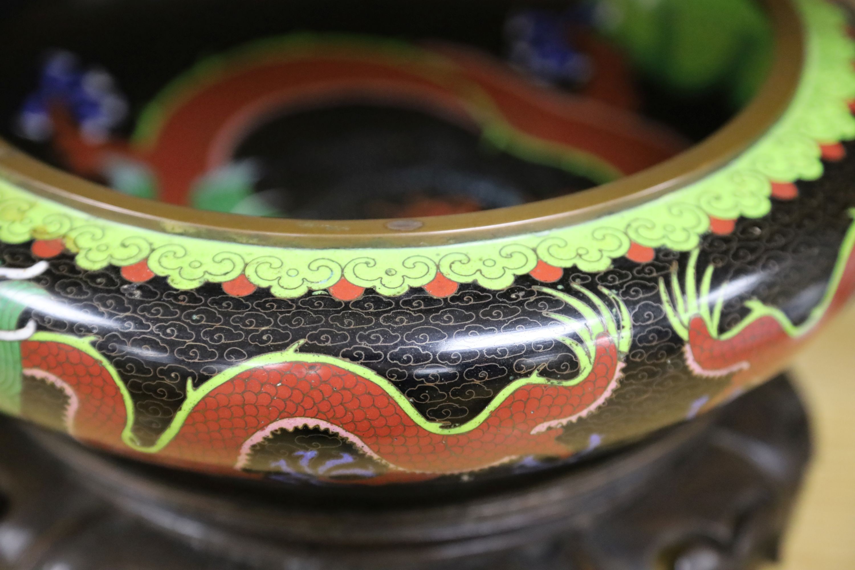 A large early 20th century Chinese cloisonné enamel ‘dragon’ bowl and two Chinese Tongzhi celadon ground famille rose bowls 31cm